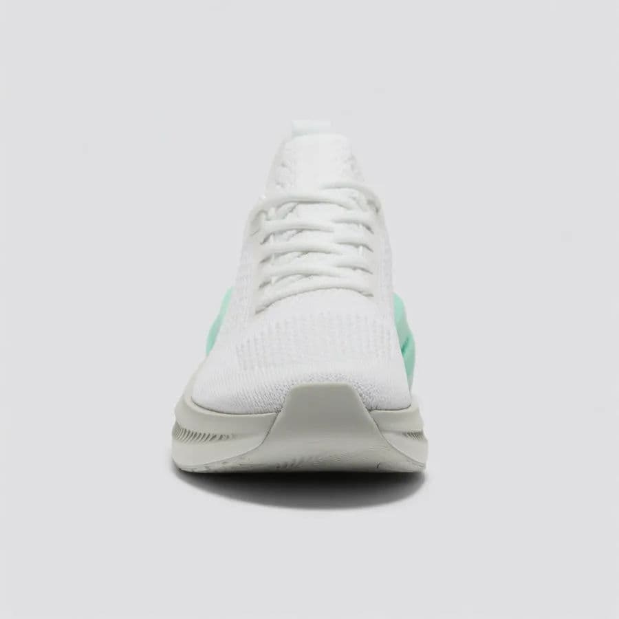 Front view of a white running sneaker on a light background