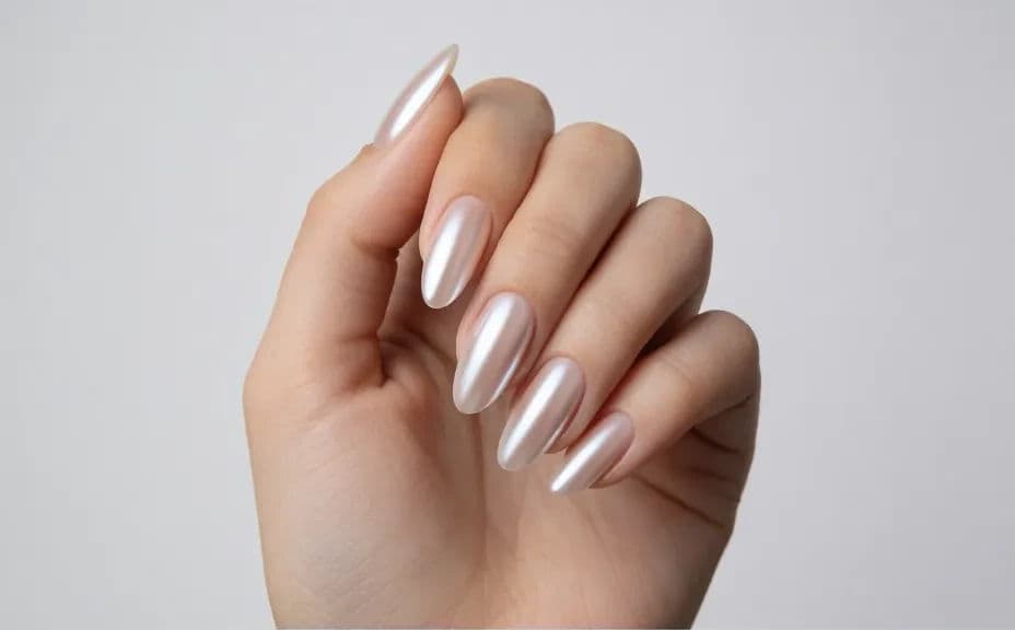 Almond nails in soft chrome shown in a close portfolio shot