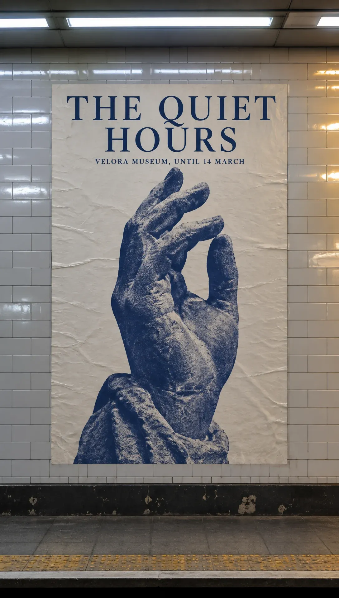 Transit poster for a museum exhibition seen on a platform wall