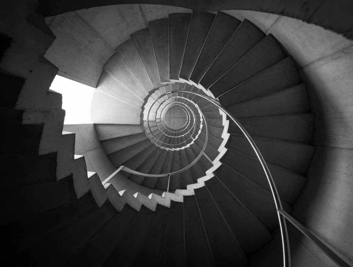 Black and white architectural photograph of a concrete stairwell with raking light on the treads, generated with Krea 2 Medium