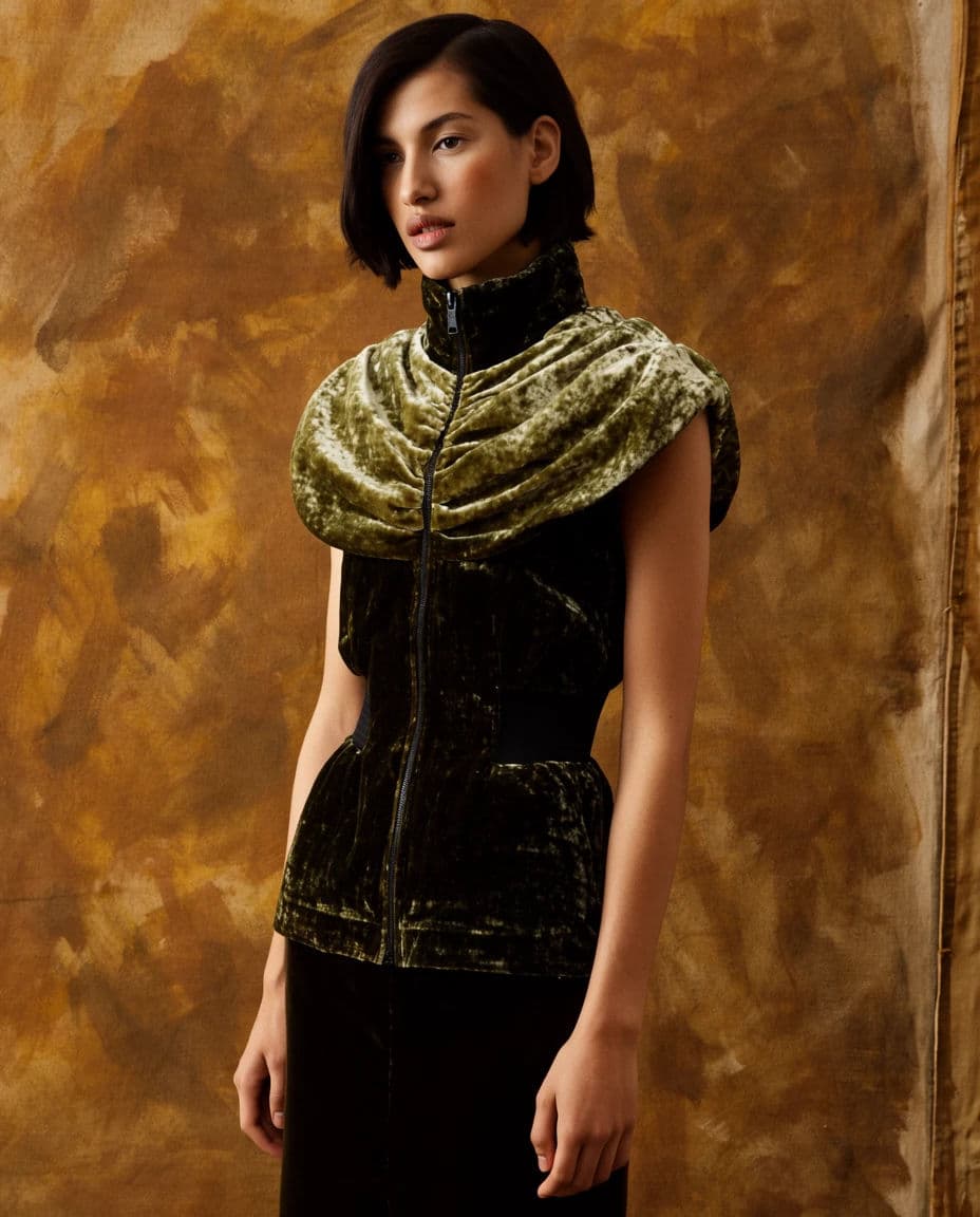 Fashion editorial frame of a model against a hand-painted canvas backdrop, generated with Krea 2 Large