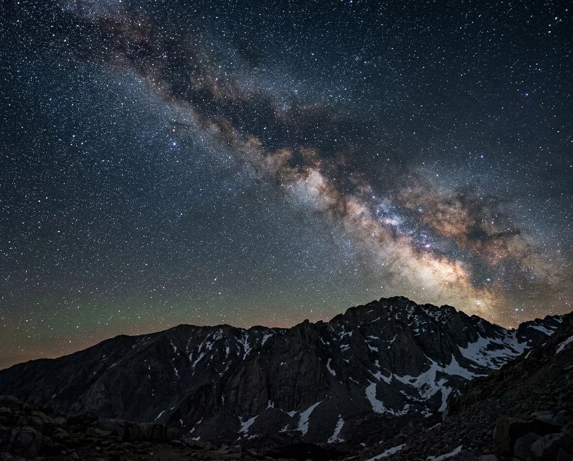 Night landscape photograph of a dense star field above a granite ridge lit faintly by starlight alone, generated with Nano Banana 2
