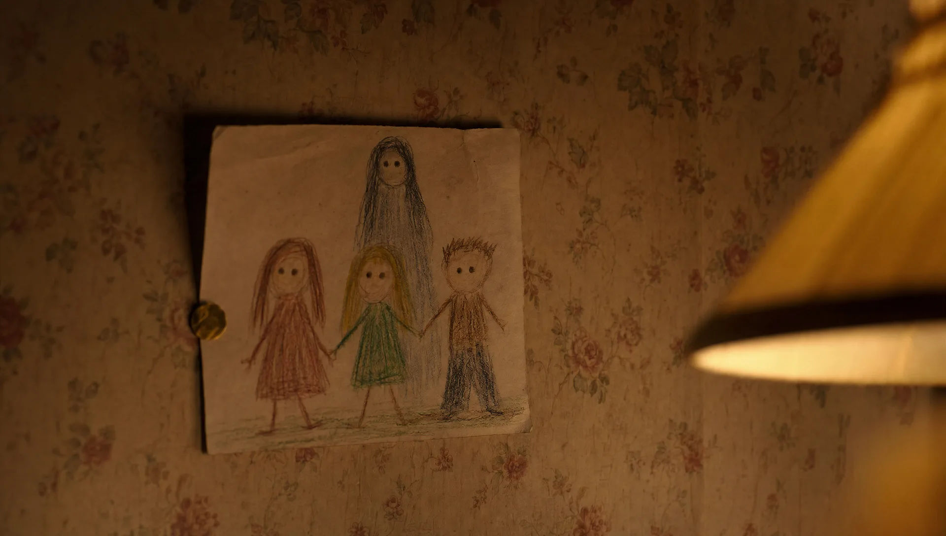 Child's crayon drawing on yellowed wallpaper